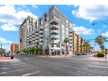 Contemporary building with large windows and balconies in a vibrant urban setting at 353 E Bonneville Ave # 311, Las Vegas, NV 89101
