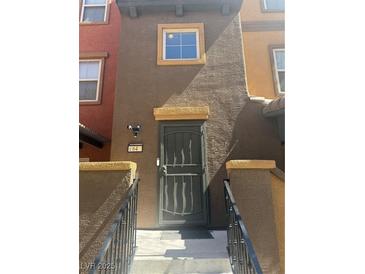Charming home exterior featuring a secure metal screen door and inviting front entrance at 4650 Ranch House Rd # 64, North Las Vegas, NV 89031