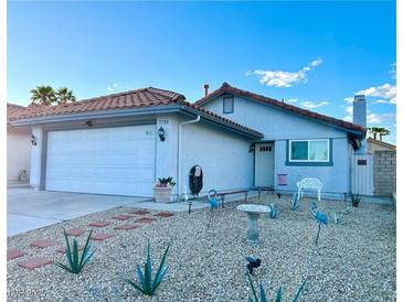 Charming single-story home with a two-car garage and desert landscaping at 7728 Barbican Ct, Las Vegas, NV 89147