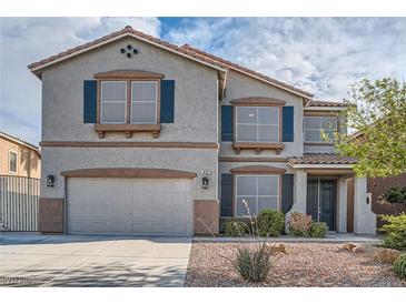 Charming two-story home featuring a two-car garage and inviting front yard at 823 Safflower Ct, Henderson, NV 89015