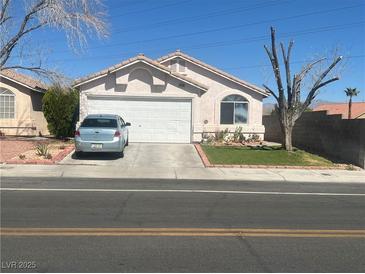 Charming single-story home featuring a two-car garage and well-maintained front yard at 8408 W Gilmore Ave, Las Vegas, NV 89129