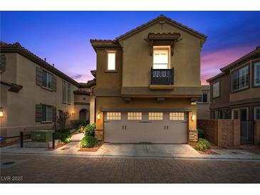 Charming two-story home featuring a stone pathway, two-car garage, and inviting curb appeal at 11322 Corsica Mist Ave, Las Vegas, NV 89135