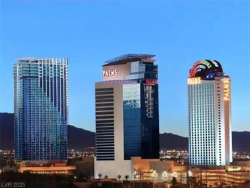 Beautiful view of the Palms Place towers at night, with mountain views at 4381 W Flamingo Rd # 1019, Las Vegas, NV 89103
