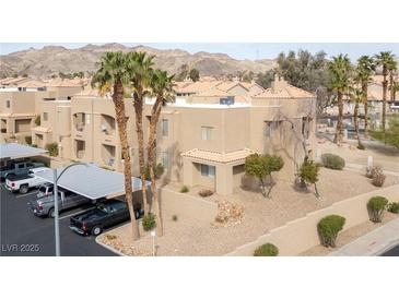 Condo exterior with desert landscaping, tile roof, and covered parking in a gated community at 2160 Highpointe Dr # 103, Laughlin, NV 89029