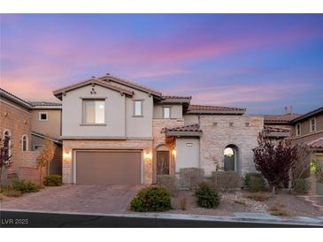 Stunning two-story home with stone accents, desert landscaping, and a two-car garage at 258 Castellari Dr, Las Vegas, NV 89138