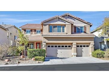 Inviting two-story home with a well-manicured yard and a spacious three-car garage at 3065 Lenoir St, Las Vegas, NV 89135