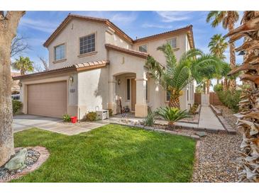 Charming two-story home with a well-maintained lawn and inviting curb appeal at 3728 Russell Peterson Ct, Las Vegas, NV 89129