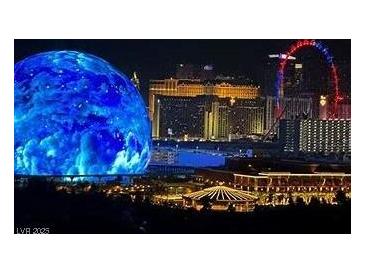 Panoramic nighttime view of the Las Vegas strip featuring the MSG Sphere and the High Roller observation wheel at 725 N Royal Crest Cir # 227, Las Vegas, NV 89169