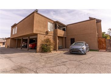 A two story home with multiple parking spots and car port perfect for multiple residents at 1467 Hialeah Dr # D, Las Vegas, NV 89119