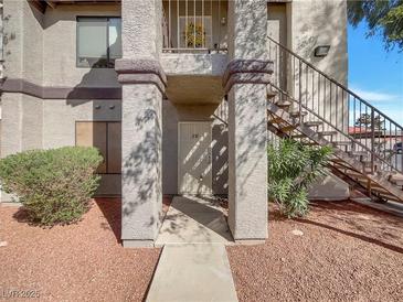Inviting condo with a private entrance and well-maintained landscaping provides a warm and welcoming curb appeal at 1575 W Warm Springs Rd # 1111, Henderson, NV 89014