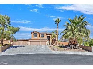 Stunning two-story home with well-manicured landscaping and a spacious three-car garage at 6116 Golden Saddle St, Las Vegas, NV 89130