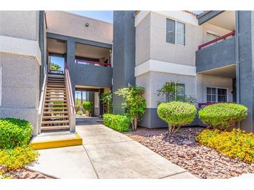 Well-maintained building exterior featuring tidy landscaping and a welcoming walkway at 8600 W Charleston Blvd # 2190, Las Vegas, NV 89117