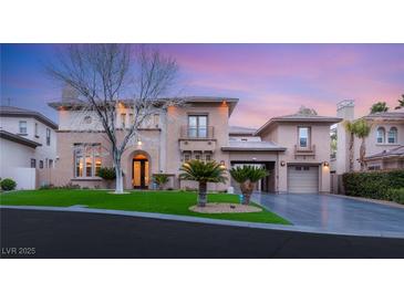 Elegant two-story home featuring well-manicured lawn and a spacious driveway at 10412 Mansion Hills Ave, Las Vegas, NV 89144