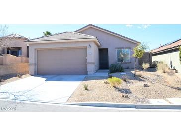 Charming single-story home featuring a two-car garage and low-maintenance desert landscaping at 2679 Lochleven Way, Henderson, NV 89044