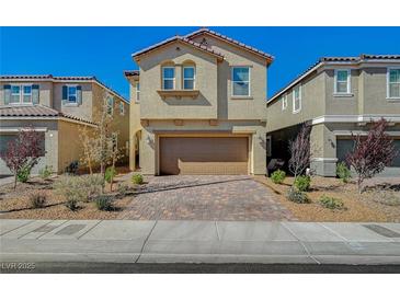 Charming two-story home featuring desert landscaping and a brick-paved driveway at 3164 Bormida Ave, Henderson, NV 89044