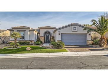 Charming single-story home features a desert landscaped front yard and attached two car garage at 10235 Tresor Ct, Las Vegas, NV 89135