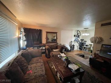 Cozy living room featuring comfortable seating and ample space with natural light at 1351 Dorothy Ave # 3, Las Vegas, NV 89119