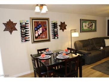 Stylish dining area featuring modern table setting, wine racks, and decorative artwork at 2048 Mesquite Ln # 303, Laughlin, NV 89029