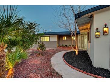 Charming single story home featuring desert landscaping, a curved walkway, and custom wall planters at 1401 S 17Th St, Las Vegas, NV 89104