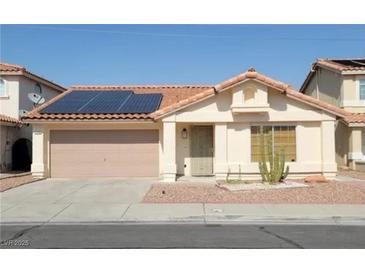 Charming single-story home with solar panels, a two-car garage and low maintenance landscaping in a sunny neighborhood at 1418 Lodgepole Dr, Henderson, NV 89014
