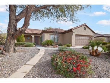 Charming single-story home with desert landscaping, front walkway, and a two-car garage at 2052 Powder Springs St, Henderson, NV 89052