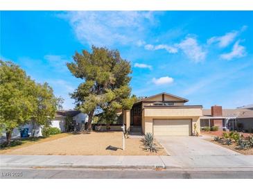 Charming single-Gathering home featuring a well-maintained front yard and attached two-car garage at 4406 Flowerdale Ct, Las Vegas, NV 89103