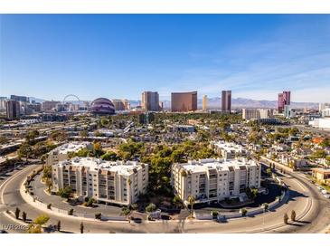 Stunning aerial view of condos, landscaping, and the Las Vegas strip skyline on a clear day at 730 S Royal Crest Cir # 426, Las Vegas, NV 89169