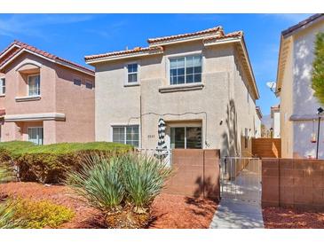Charming two-story home features a well-maintained front yard and gated entrance at 3023 Sunrise Bay Ave, North Las Vegas, NV 89031