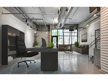 Modern office space featuring sleek desk, bookshelves, and expansive windows offering abundant natural light at 353 E Bonneville Ave # 183/283, Las Vegas, NV 89101