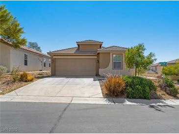 Charming single-story home with a two-car garage and desert landscaping for low maintenance at 4016 Balsam Mountain St, Las Vegas, NV 89129