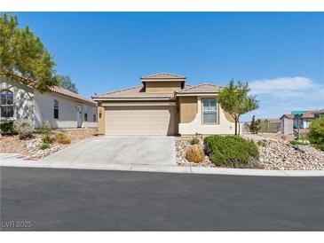Charming single-story home featuring a two-car garage and low-maintenance desert landscaping at 4016 Balsam Mountain St, Las Vegas, NV 89129
