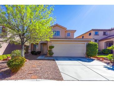 Charming two-story home with a well-maintained front yard and a two car garage at 9849 Ridge Hill Ave, Las Vegas, NV 89147