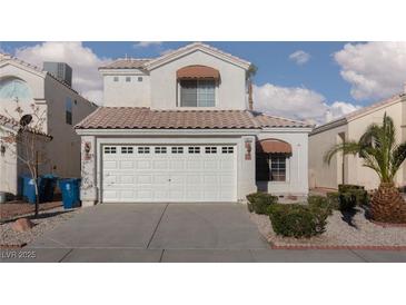 Charming two-story home with a well-maintained front yard and attached two-car garage at 1813 Villa Vista Way, Las Vegas, NV 89128