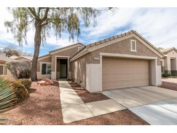 Charming single-story home with a two-car garage and low-maintenance desert landscaping at 2175 Point Mallard Dr, Henderson, NV 89012