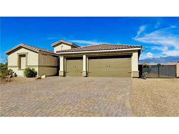 Charming home featuring a tile roof, neutral paint, and a spacious two-car garage at 4680 Suntree Ct, Pahrump, NV 89061