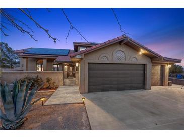 Charming single-Gathering home boasts a tile roof, three-car garage and solar panels at 5690 N Park St, Las Vegas, NV 89149