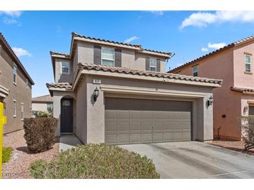 Charming two-story home featuring a two-car garage and tile roof at 922 Harbor Ave, Henderson, NV 89002