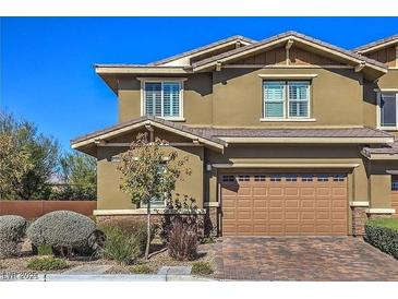 Charming two-story home with a two-car garage, neat landscaping, and a classic architectural design at 10398 Addie De Mar Ln, Las Vegas, NV 89135