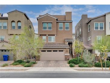 Charming two-story home with a two-car garage and well-manicured landscaping at 105 Campbelltown Ave, Henderson, NV 89015