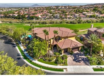Beautiful two-story home with lush landscaping and a view of the golf course at 2994 San Lorenzo Ct, Henderson, NV 89052