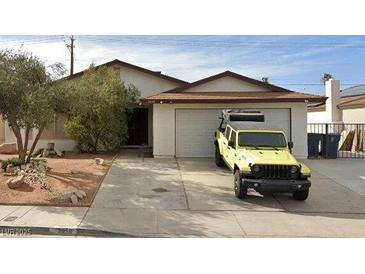 Charming single-story home featuring a well-maintained front yard and a convenient attached garage at 3959 Avila St, Las Vegas, NV 89103
