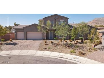 Beautiful two-story home with a three-car garage and professionally landscaped front yard at 4001 Turquoise Falls St, Las Vegas, NV 89129