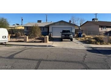 Modest single-story home with a driveway and garage on a sunny day at 4805 Terra Linda Ave, Las Vegas, NV 89120