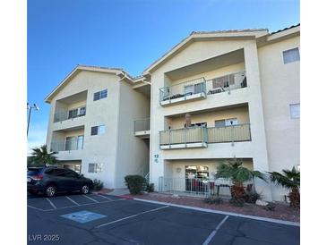 Inviting condo complex featuring balconies, well-maintained landscaping, and ample parking at 3550 Bay Sands Dr # 3089, Laughlin, NV 89029