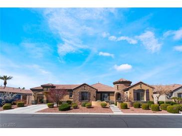 Beautiful single-story home with lush landscaping, private driveway, and desert-friendly grounds at 5027 Crown Cypress St, Las Vegas, NV 89149