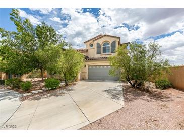 Charming two-story home featuring a well-manicured lawn and a two-car garage at 11769 Via Vera Cruz Ct, Las Vegas, NV 89138
