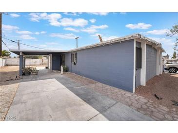 Charming single story home with carport and blue painted exterior at 1520 Teton St, Las Vegas, NV 89101