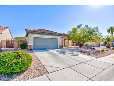 Charming single-story home featuring desert landscaping, a two-car garage, and a welcoming entrance at 2341 Rosendale Village Ave, Henderson, NV 89052