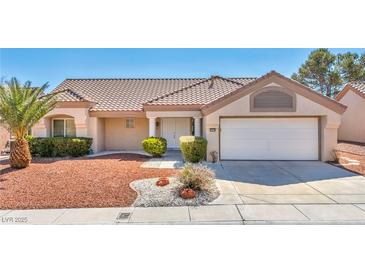 Charming single-story home with a well-maintained front yard and a two-car garage at 2628 Showcase Dr, Las Vegas, NV 89134