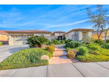 Charming single story home with a well-manicured lawn and covered three car garage at 2872 Sumter Valley Cir, Henderson, NV 89052